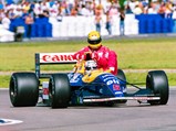 1991 British Grand Prix winner Nigel Mansell in Williams FW14-5 gives Ayrton Senna a lift back to the pits after the latter ran out of fuel on the final lap.