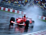 Michael Schumacher drives through the rain on his way to victory at the 2003 Canadian Grand Prix.