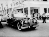King Mohammed V of Morocco in his Delahaye on the way to give a speech, 1957.