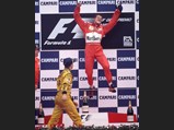 Michael Schumacher celebrates his victory at the 1998 Italian Grand Prix.