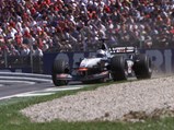 David Coulthard guides the McLaren MP4-16 around the track en route to victory at the Austrian Grand Prix.