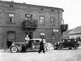 1934 Packard Twelve Individual Custom Convertible Sedan by Dietrich - $Parked on street in front of restaurant in Kozieglowy, Poland - August 12, 1934.