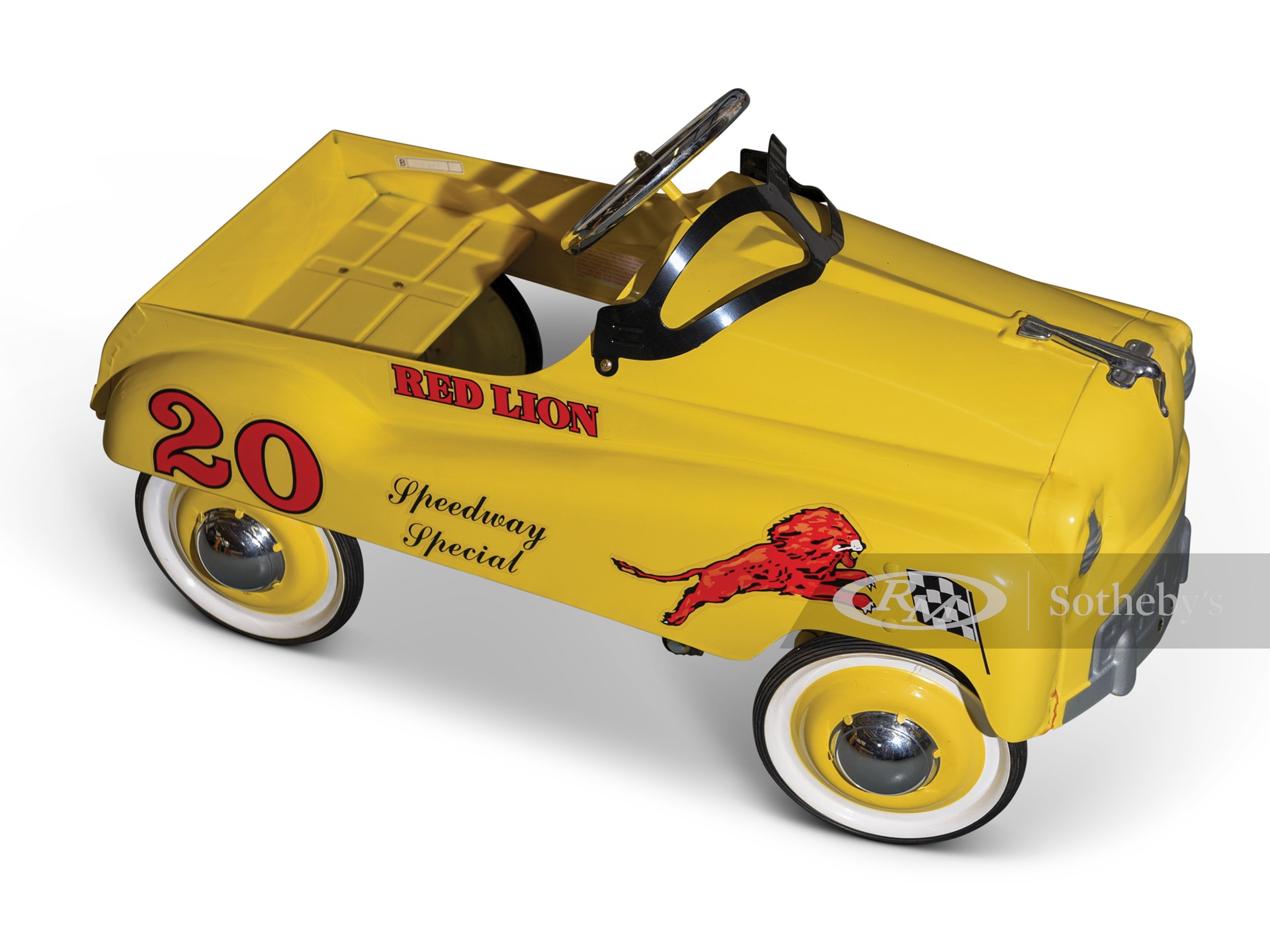 red and yellow pedal car