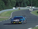 The Jaguar approaches the entry to The Porsche Curves during the 1993 24 Hours of Le Mans.