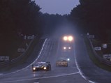 1993 Jaguar XJ220 C LM  - $The Jaguar XJ220 C LM driven by Richard Piper, Tiff Needell, and James Weaver leads down the hill as night falls on the 1995 24 Hours of Le Mans.