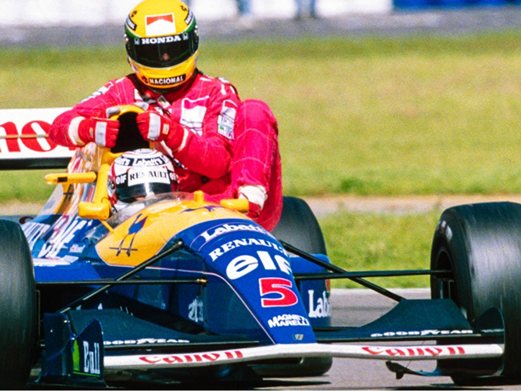 Nigel Mansell giving Aryton Senna a ride with his 1991 Williams FW14 which will be offered at RM Sothebys Monaco auction