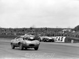XKD 518 races by several less fortunate cars at the 8th Annual International Daily Express Trophy Meeting, Silverstone, 5 May, 1956.