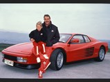 Nigel Mansell is pictured with his Ferrari Testarossa, presented to the driver while racing for Scuderia Ferrari.