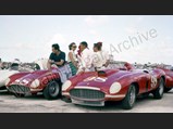 Left to right: Alfonso de Portago, Joe Landaker, Masten Gregory, and friends, with John Edgar's Ferraris #88 857 Sport and #98 410 Sport, Nassau Speed Week paddock, December 1956.