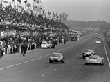 Wearing race number 58, chassis 1725 powers past the pit lane crews at the 1967 24 Hours of Le Mans.