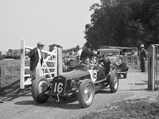 1927 Delage 15-S-8 Grand Prix  - $Giulio Ramponi, Richard Seaman’s mechanic, gets a hand out of the paddock at Donington for the British Empire Trophy Meeting, 4 April 1936.