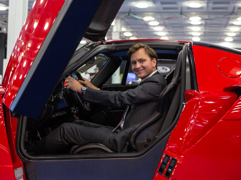 RM Sothebys Car Specialist Stephan Knobloch sitting in a 2003 Ferrari Enzo at London Fall 2019. 