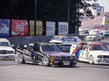 Schenider wore race number “4” as he is captured here trying to overtake Roberto Ravaglia’s BMW M3 Sport Evolution in the 190 E 2.5-16 Evolution II at the Noisring Nürnberg on 28 June 1992. 