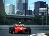 1998 Ferrari F300 - $Schumacher rounds a corner at Circuit Gilles Villeneuve, Montreal on 7 June 1998.