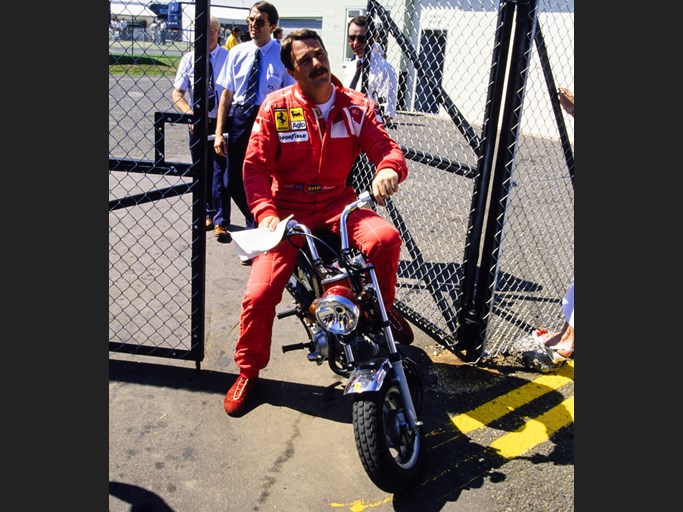 Nigel Mansell captured going through a gate at Silverstone Circuit before the 1990 British Grand Prix, he went on to claim pole position and set the fastest lap.