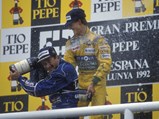 Michael Schumacher and Nigel Mansell celebrate atop the podium after the 1992 Spanish Grand Prix.